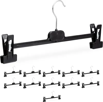 Immagine prodotto di Set di 12 appendiabiti per pantaloni, ciascuno con 2 clip, adatti per pantaloni e gonne. Dimensioni: 15 x 35,5 x 2,5 cm. Materiali: polipropilene e ferro. Colore: nero