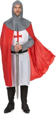 A man wearing a knight costume holding a sword.