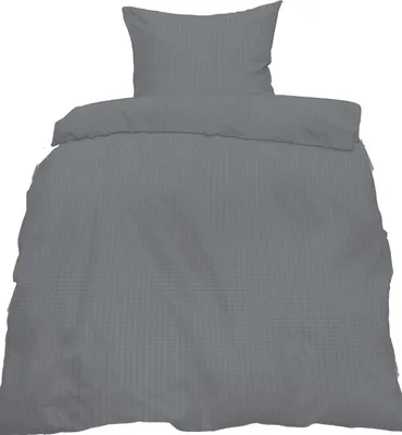 A gray duvet cover and pillowcase set, folded and laid flat against a white background.