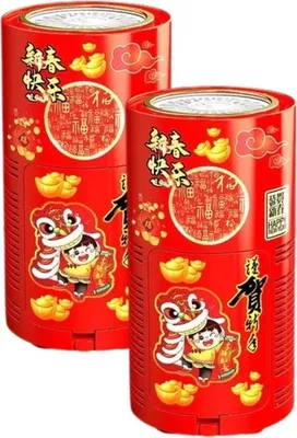 Two red cylindrical containers decorated with Chinese New Year motifs, including a lion dance, children, and gold ingots.