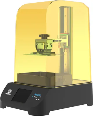 A 3D printer with a yellow protective cover.