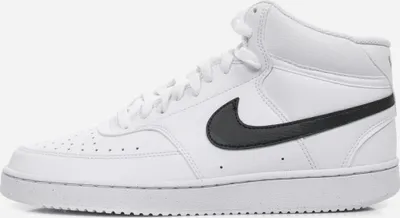 A side view of a white Nike Court Vision Mid Nn shoe with a black Nike swoosh.