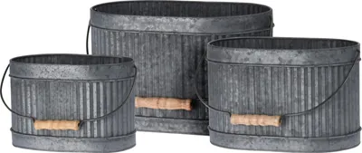 Three galvanized metal buckets of varying sizes are arranged together on a white background.