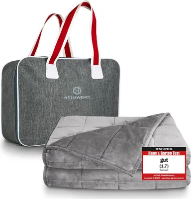 A weighted blanket and its storage bag are displayed on a white background. A review badge is attached to the blanket.