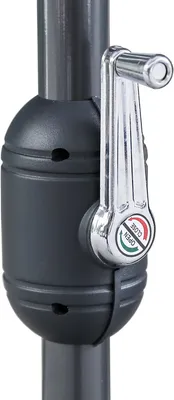 A close-up view of a crank mechanism on a patio umbrella pole.