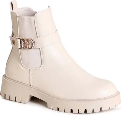 A single beige boot is shown from a side-diagonal view against a white background.