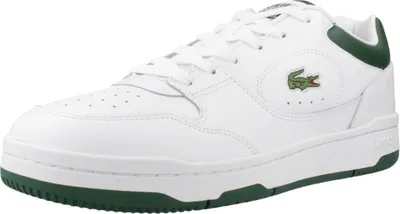 A white Lacoste sneaker with green accents.