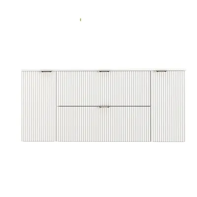 A white vanity cabinet with fluted fronts and metal handles is shown against a white background.