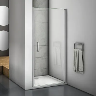 A modern shower enclosure with a glass door and a towel rack on the wall.