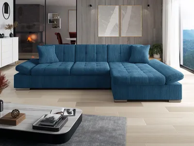 A modern living room with a blue sectional sofa as the main focus.