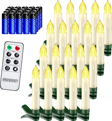 A collection of battery-operated LED candles and a remote control.