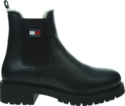A black Tommy Hilfiger Chelsea boot with a white and red logo on the side.