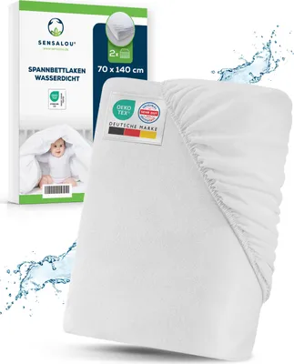 A white fitted sheet is shown with a baby peeking out from under it, next to a product box.