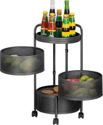 A three-tier rotating storage rack with baskets, filled with produce and bottles.