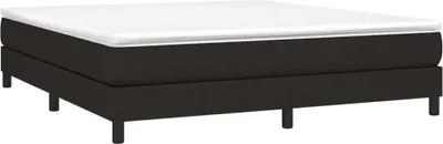 A black bed frame with a white mattress on top, shown from a side angle.