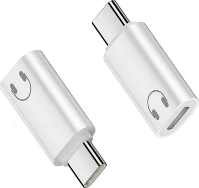 Two white USB-C to headphone jack adapters are shown against a white background.