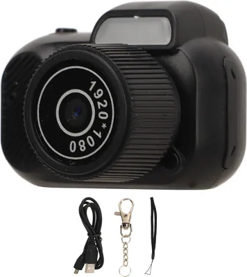 A small black digital camera with accessories.