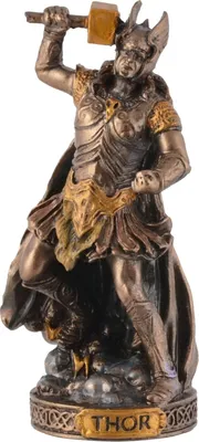 A statue of Thor, the Norse god of thunder, is depicted in full armor, raising his hammer for an attack. The statue is presented on a decorative base with the name 'THOR' inscribed.