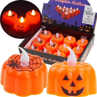 A set of Halloween-themed pumpkin lanterns displayed in a box and some in the foreground.