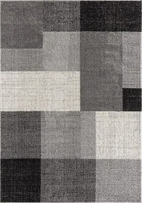 A flat lay of a rectangular rug with a geometric pattern of varying shades of gray, black, and beige.