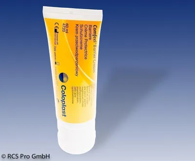 A tube of Coloplast Comfeel Barrier Cream is shown against a blue and gray gradient background.