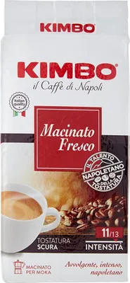 A bag of Kimbo coffee beans with a cup of coffee and coffee beans shown.