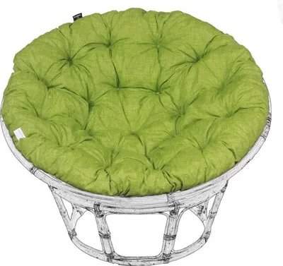 A round, green cushion on a white rattan chair.