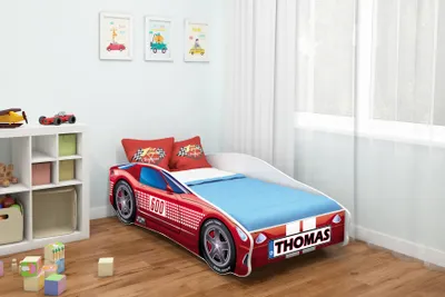 A child's bedroom with a car-themed bed.