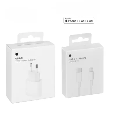 Two white Apple product boxes are shown side-by-side against a white background. The box on the left contains a 20W USB-C power adapter, and the box on the right contains a USB-C to Lightning cable.