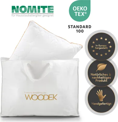 A pillow in a white fabric bag with branding and certifications displayed around it.