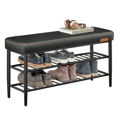 A shoe bench with shoes on its shelves and headphones on top.