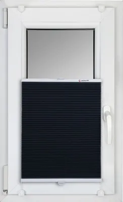 A black pleated blind is installed in a white window frame.