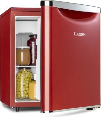 A red mini-refrigerator with its door open, showing jars of food inside.