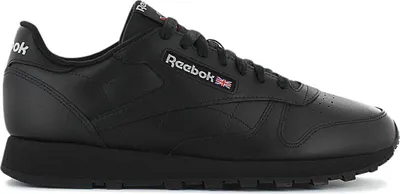 A studio shot of a single black Reebok sneaker.