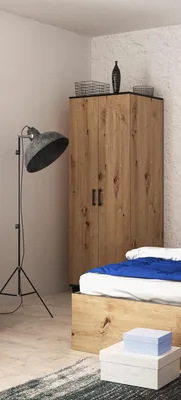 A bedroom scene with a wardrobe, bed, and floor lamp.