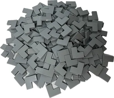 A pile of small, grey, L-shaped building blocks.