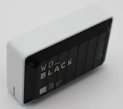 A white and black external hard drive with the WD_BLACK logo and Xbox branding.
