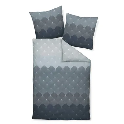 A bedding set with two pillows and a duvet cover, laid out flat on a white background.