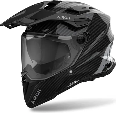 A studio shot of a black and gray Airoh Commander 2 Full Carbon Motocross Helm.
