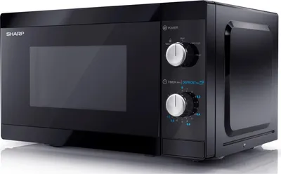 A black Sharp microwave oven is shown from a three-quarter angle on a light gray reflective surface.