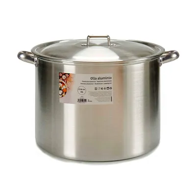 A large, silver aluminum cooking pot with a lid and handles, shown against a white background. A label is attached to the side of the pot.