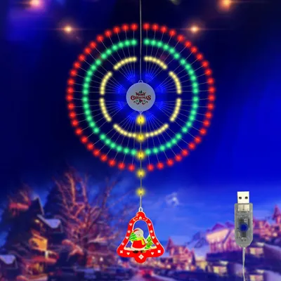A festive Christmas decoration with colorful lights and a bell pendant, set against a dark, snowy village background.