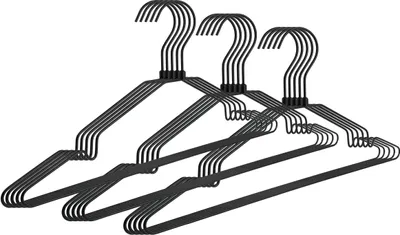 Three black metal hangers are arranged diagonally.