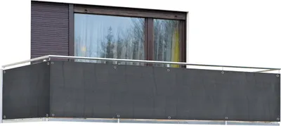 A balcony with a dark gray privacy screen attached to the railing.