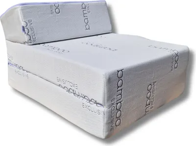 A white foldable mattress is shown in a studio setting.