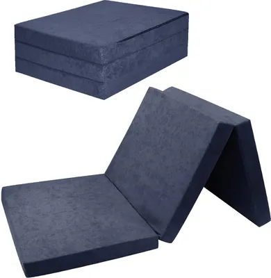A folded and unfolded navy blue mattress.