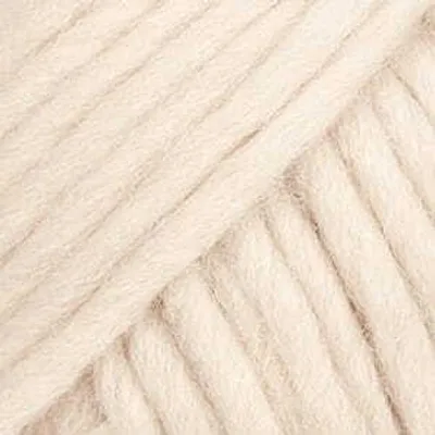 A close-up, diagonal view of thick, cream-colored yarn.
