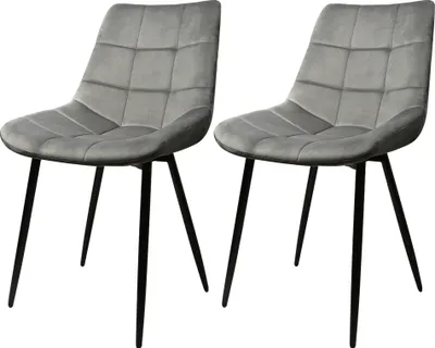 Two grey upholstered dining chairs with black metal legs are shown against a white background.