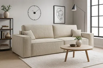 A modern living room with a beige sofa, coffee table, and decorative items.