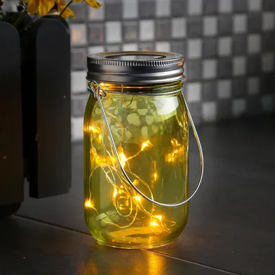 Produktbild von LED Solar Glas - Windlicht - mit Drahtlichterkette - Lichtsensor - H: 14cm - D: 8cm - grün